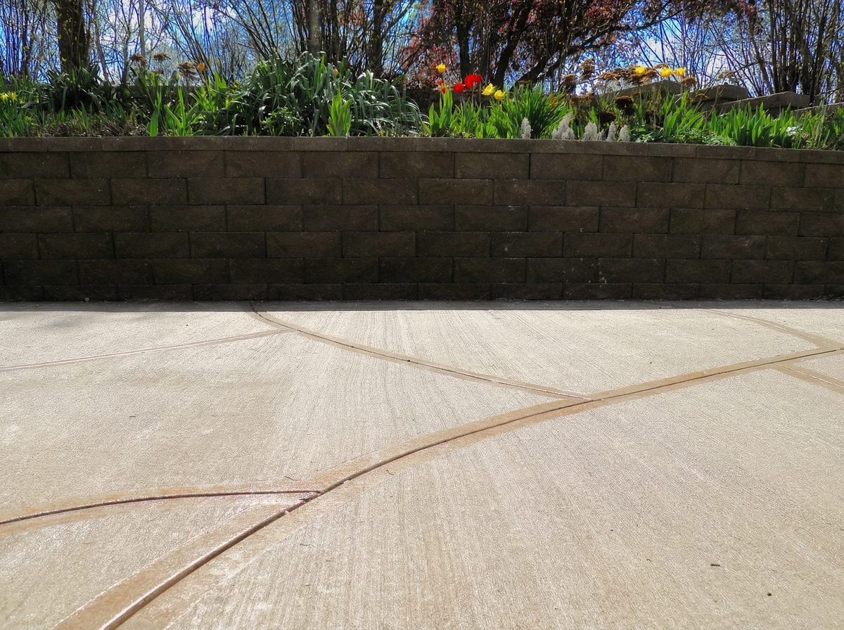Stamped patio with garden wall
