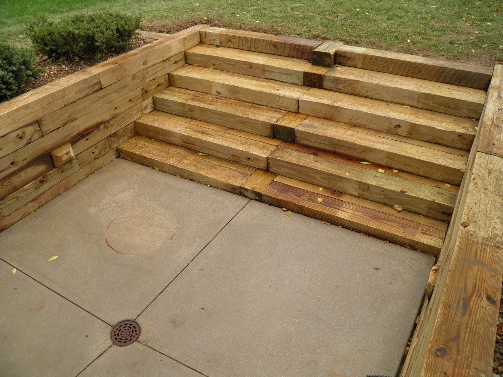Timber retaining wall with steps and patio